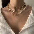 Layered gold chain necklace with pearls and rhinestone accents on model neck - 05 Gold