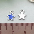 Star-shaped blue enamel alloy charm and silver textured pendant measured on a ruler - 1Pc Royal Blue Star