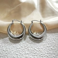 Macro detail of high-quality polished silver hoop earrings with secure clasp mechanism - 30MM / Silver