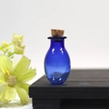 Mini oval dark blue glass wishing bottle with cork stopper on wooden stand - Blue Oval Bottle With Cork