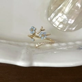 Elegant gold branch ring featuring delicate blue flowers and sparkling crystal accents - Tree Branch Blue Flower (J6125)