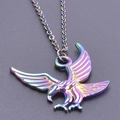 Macro shot of eagle pendant necklace featuring a vibrant rainbow electroplated finish - Rainbow Color + Necklace Chain