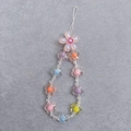 Macro detail of colorful acrylic flower beads on a sweet style mobile phone charm strap - Small Flower Phone Chain Pink Jelly AB