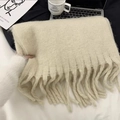 Cozy beige oversized fuzzy scarf with fringe tassels in a warm home office setting - 230*35cm / Beige