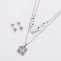 Detail of double-layer stainless steel necklace with square evil eye charms and stud earrings - Steel White