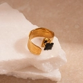 Detailed view of gold-plated hammered ring featuring a square black gemstone on stone - Black Square Style (TR94)