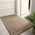 Brown rectangular entrance mat with geometric woven texture on grey tiled floor - Tantu