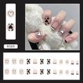 Detail view of R589 press-on nails with pink base, black hearts and French stripes - R589 Black and White Heart