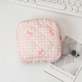 Quilted pink checkered cosmetic bag featuring small bow patterns and zipper closure - Pink Gingham with Bow