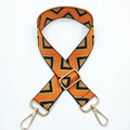 Detail of adjustable 3.8cm wide strap with orange geometric waves and gold lobster hooks - Orange Brown Triangle