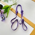 Detailed view of a purple braided nylon strap with dual adjustable buckles on white background - Purple Shoulder Strap
