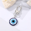 Blue Evil Eye keychain with silver alloy clasp and glitter resin circular pendant - 18mm / Silver