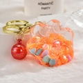 Acrylic cat paw keychain in translucent orange with colorful beads and gold metal ring - Bead Paw Style / Orange
