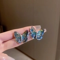 Macro detail of butterfly earrings with iridescent wings, pearls and sparkling crystals - Blue-Green Gradient Butterfly (S925 Silver Pin)