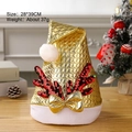 Golden sequin Christmas hat with red antlers and white pom-pom on wooden table - Foam Cloth Sequin Antlers Hat Gold