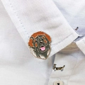 Detail of dog enamel pin showing high-quality zinc alloy and painted finish on a shirt collar - Leonberger