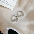Macro shot of silver twisted hoop earrings with delicate metal mesh texture on a shell tray - 33# Silver Delicate Twisted Mesh Ear Cuff