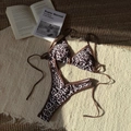 Detailed flat lay of leopard print bikini set on a textured beige fringe rug background - S / Brown Leopard Print