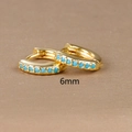 Macro view of 6mm golden huggie earring with inlaid light blue turquoise zircon stone - 6mm / Gold (Blue Zircon)