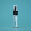 Clear 100ml plastic refillable spray bottle with black mist nozzle and cap on teal background - 20ml / Transparent Bottle Black Spray