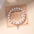 Faux pearl beaded bracelet with rhinestone spacers and metal cross pendant on display card - Silver Cross Rhinestone Pearl