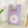 Purple knit tote bag featuring a white daisy flower pattern and spring themed lettering - Purple Disk Flower Bag
