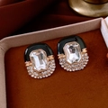 Detail of vintage enamel earrings with rhinestones on a red velvet cushion in a gift box - Silver Earring Post-Black