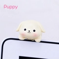 Close-up of a cream cartoon puppy ornament for car and monitor decoration - Little Dog Monitor Hanger