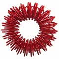 Macro shot of a red metallic sensory spring finger massage ring on white background - Red