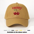 Detail of mustard yellow cotton baseball cap with red cherry print and happy slogan - One Size / Turmeric