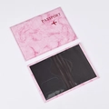 Detail view of pink marble passport holder with interior card slots and stitching - Pink