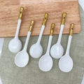 Set of 6 white ceramic spoons with gold-accented handles on a wooden board - Gold Plated Japanese Soup Spoon 6Pcs