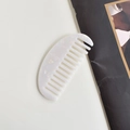 Elegant white crescent wide-tooth acetate hair comb with pearlescent marble finish - Mermaid Oval