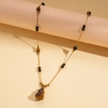 Detail of 18k gold plated necklace featuring tiger eye gourd pendant and black beads - Necklace-Brown-Gourd (Gold Plated)