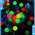 Glow in the dark 32mm bouncy balls in vibrant assorted colors on a dark grid surface - 25mm / Luminous Frosted Bouncy Ball