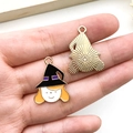 Handheld view of alloy Halloween witch charms with purple hat and golden back finish - Black Orange Wizard