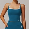 Peacock blue yoga set featuring a halter neck sports bra with white contrast piping - S / Deep Sea Blue