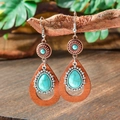 Macro shot of bohemian vintage drop earrings with turquoise stones and wooden beads details - Bronze Metal Wood Pendant (HQEF-1104)