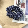 French vintage dark blue scrunchie with white polka dots on a beige tray display - Navy Blue