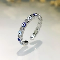 Macro shot of silver evil eye ring with blue enamel and sparkling cubic zirconia stones - Silver-Blue+Light Blue