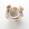 Three-piece nesting set of cream woven cotton storage baskets with teddy bear charms - White Basket Bear