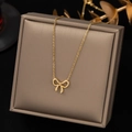 Elegant gold bow pendant necklace for women displayed on a luxury jewelry gift box - Gold