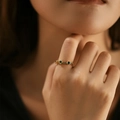Detail of adjustable gold ring featuring round green gemstones in a vintage setting - Adjustable Open / Green (KR0040-3)