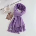 Flat lay of soft purple faux cashmere scarf with fringes and cozy lifestyle props - Regular Fit / Lilac Purple