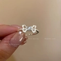 Adjustable silver bow ring featuring a grey cat eye stone and beaded texture band - J948 Bowknot Cat Eye Stone Open Ring