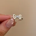 Adjustable silver bow ring featuring a grey cat eye stone and beaded texture band - J948 Bowknot Cat Eye Stone Open Ring