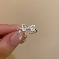 Adjustable silver bow ring featuring a grey cat eye stone and beaded texture band - J948 Bowknot Style (J948)