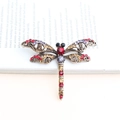 Vintage dragonfly brooch with multi-colored crystals on an antique gold metal base - Reddish Brown
