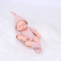 Realistic 20cm reborn baby doll in pink knitted outfit sleeping on a soft white fur blanket - Pink Knitted Style