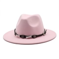 Detailed close-up of pink wool fedora with a studded leather belt and vintage star buckle - Pink